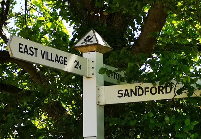 Sandford finger post with a new parking sign.
