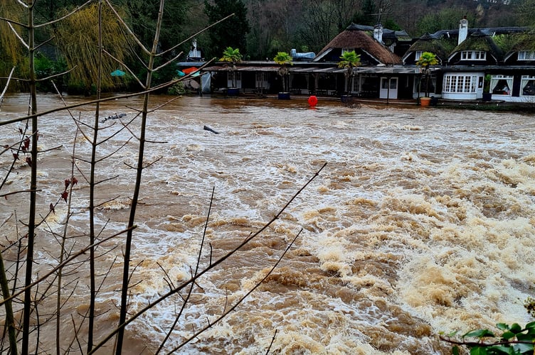 Images of the flooded River Exe at Bickleigh Bridge, The Fisherman’s Cott and Bickleigh Mill.  
