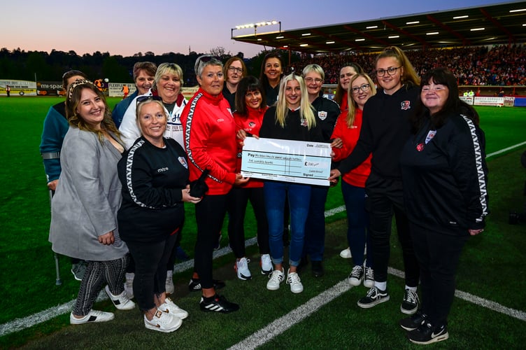 10th winners of the competition, Tiverton and Dawlish Women's walking football teams, who were presented with their cheque at St James' Park. Image: PPAUK