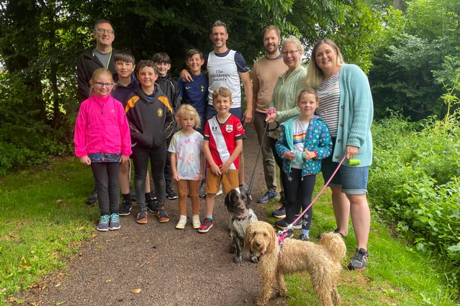 Ryan, centre, and some of his family and friends who took part in the 500th mile run in July 2022.  AQ 0753
