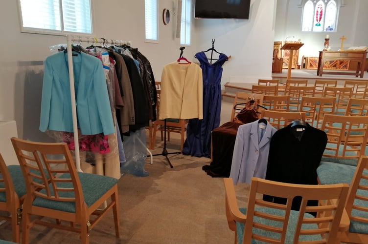 Some of the suits and clothes lined up before the sale.