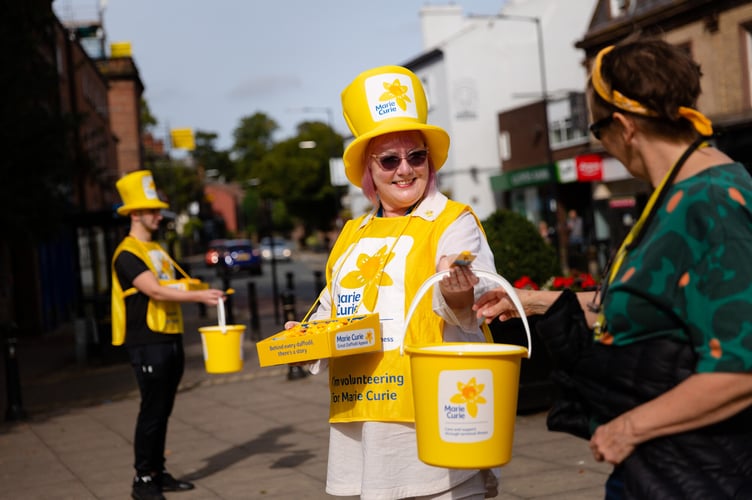 Ethan Nelson and Julie Zafari raise funds for The Great Daffodil Appeal in Woolton, Liverpool. 

This photo was taken on 21st September, 2021.