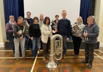 Crediton Town Band presents £406 to The Turning Tides Project
