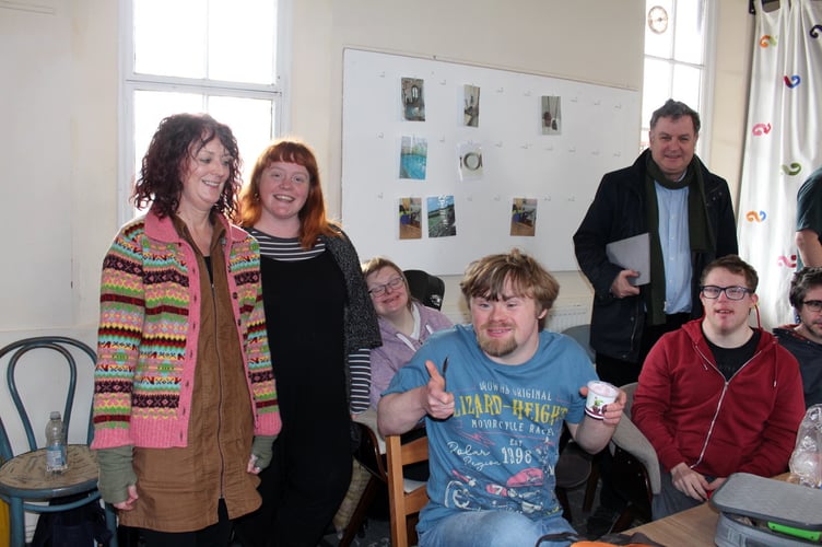 Mel Stride, standing at back, with Director Jane Williams, Senior Manager Abigail Innocent, with some of the clients in the room at the back of the Station Tea Rooms.  SR 6978
