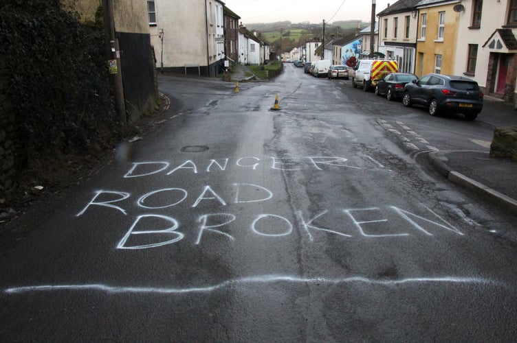 Danger - Road Broken - that was the message painted on the road at Bow recently.  Image: Adam Cory
