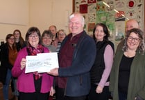 A cheque and cake for Lapford postman Eddie on his retirement
