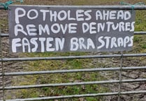 Potholes at Stockleigh English prompt new sign

