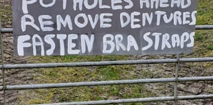 Potholes at Stockleigh English prompt new sign
