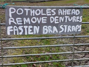 Potholes at Stockleigh English prompt new sign
