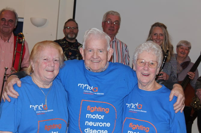Members of the Holly Valley Stompers with (left to right), Cynthia Hopkins, Association Visitor from the Motor Neurone Disease Association, Dave and Monica Blanchford.  SR 7236