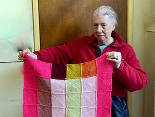 Joan has been knitting blankets for Battersea Dogs and Cats Home
