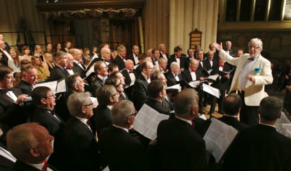 Bath Male Choir performing in Bath Abbey with founder Conductor Grenville Jones.