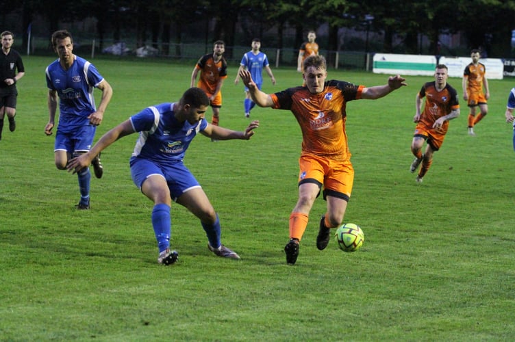 During the Crediton United FC v Brixham match, Crediton in the blue. 