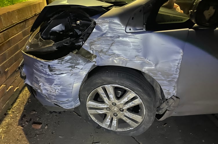 The car after it collided with the wall at Housing 21. AQ 6589