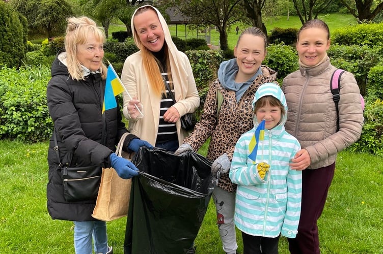 The Ukrainian group which took part in the Big Help Out by litter picking in Newcombes Meadow, Crediton.