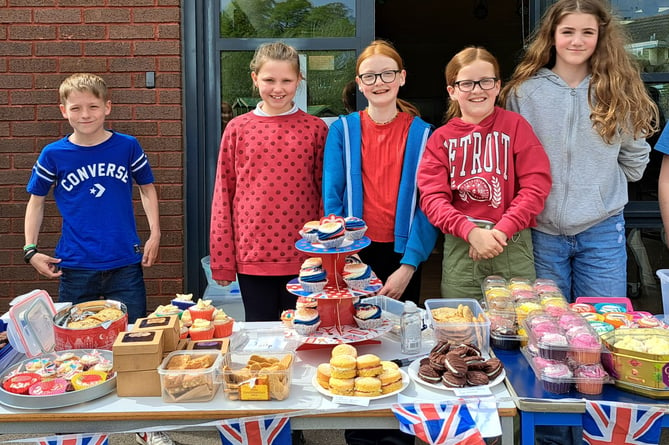 At the Coronation cake sale at Landscore Primary School.