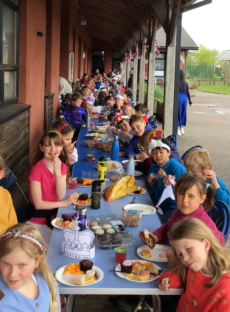 Enjoying the celebration tea at Cheriton Fitzpaine Primary School.