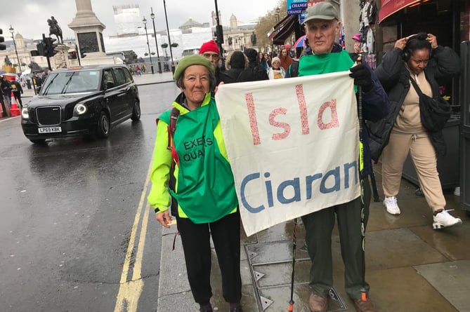 Laura and Gerald Conyngham with their banner in the march.