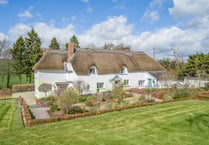 17th century thatched home for sale comes with its own "secluded" lake