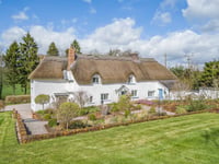 17th century thatched home for sale comes with its own "secluded" lake
