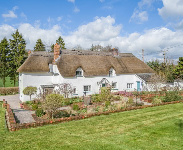 17th century thatched home for sale comes with its own "secluded" lake