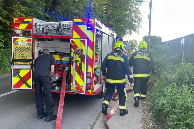 Firefighters getting into action at Cowley, near Exeter.  AQ 9206