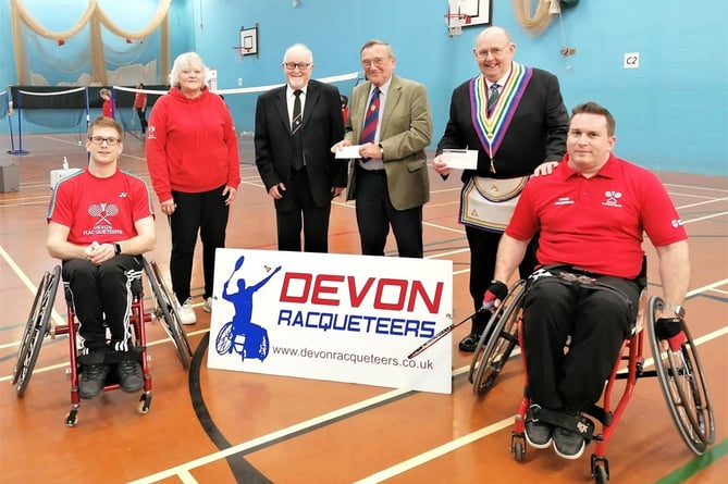 Crediton Freemasons presenting the cheques to the Devon Racqueteers Parabadminton Club.