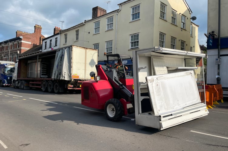 Reversing along the A377 road with a refrigerator unit.  AQ 9607