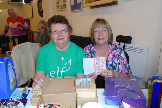 Mary Parker and Karen Todd, members of Exeter Leukaemia Fund (ELF) selling draw tickets at their very successful Meat Bingo evening at the Crediton Football Club. 