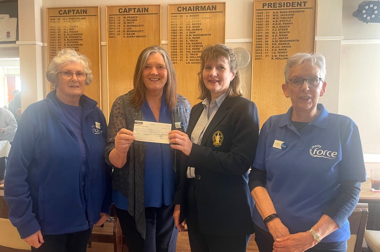 Crediton RFC chair Liz Goodman, third left, presenting the cheque for £360 to FORCE representatives Ann Thomson, left, Di Pring, second left and Sue Brown, right. AQ 7073