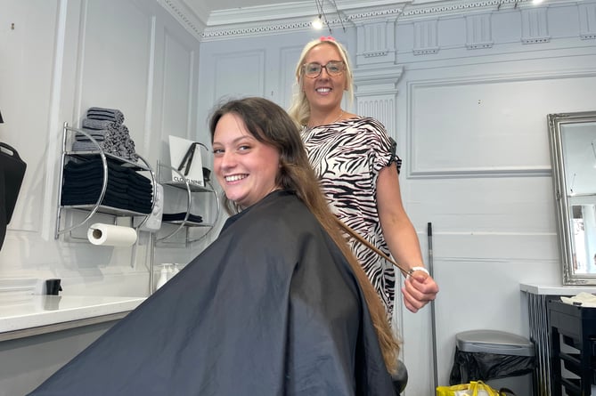 Josie Sanders, who has had alopecia most of her life, has had a hair cut for the Little Princess Trust, pictured before with Laura Penny of Jaspers Hair Salon.  AQ 9691