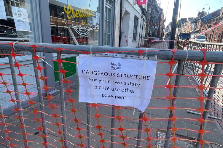One of the notices now placed on railings at the scene. AQ 0376