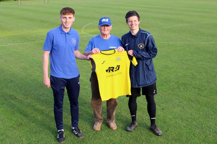 RJ Brooks and Son is the new Newton St Cyres FC sponsor and pictured centre is Bob Brooks from the business presenting the new kit to First Team manager Nathan Guppy (right) and player Fin Jeffery (left) on a sunny evening at the Rec.  