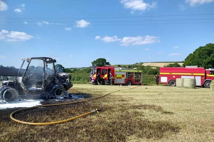 Fire crews at the scene of the telehandler fire near Yeoford.