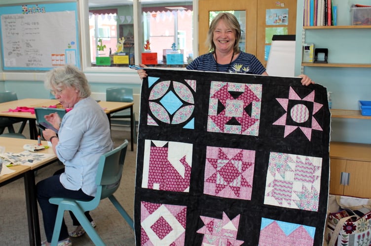 Sue Vile shows the lockdown quilt. SR 7926