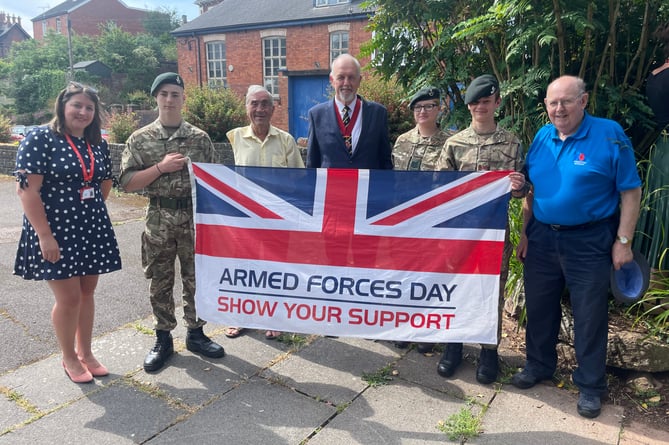 Some of those who attended the ceremony to show support at the beginning of the week to mark Armed Forces Day, The Deputy Mayor of Crediton, Cllr Steve Huxtable, centre, with Cllr Frank Letch, third left, Crediton Town Clerk, Mr Rachel Avery, left, Crediton Royal British Legion branch member Peter Brewer, right, and representatives from Crediton Army Cadets.  AQ 1444