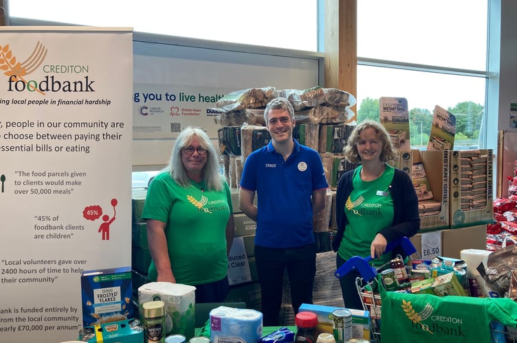 Crediton Foodbank volunteers with Crediton Tesco Community Champion Ben Collier.