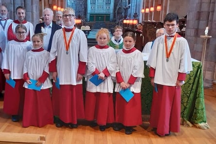 The Crediton Music Endowment Fund award recipients with some of the fund directors at Crediton Parish Church.