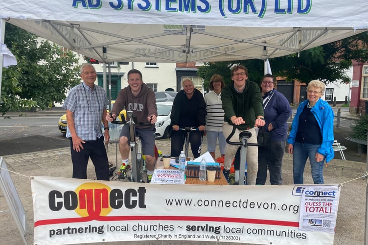 Some of the Connect schools work team and volunteers during the 12-hour cycle challenge in Crediton Town Square. AQ 3106