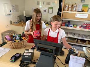 Children enjoy helping out at Spreyton Community Shop
