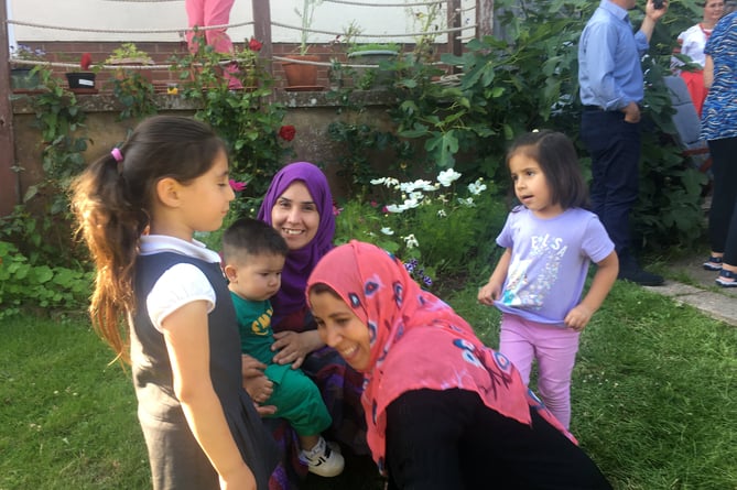 Zulaika (purple) and AiemKhal (pink) and children.