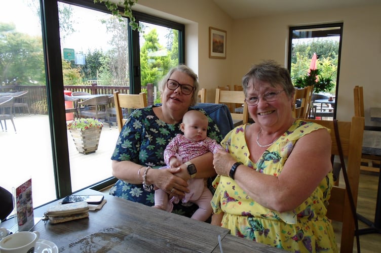 Chairman of Over 60s Lapford, Carol Worsdell, with secretary Linda Lane, and 16 week-old Elsie, Carol's great niece.