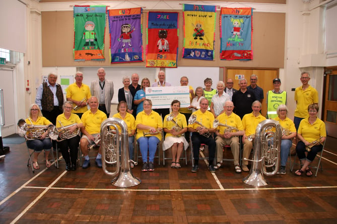 At the presentation ceremony held to present £5,100 to the Hospiscare Hospice at Home service.  AQ 1979
