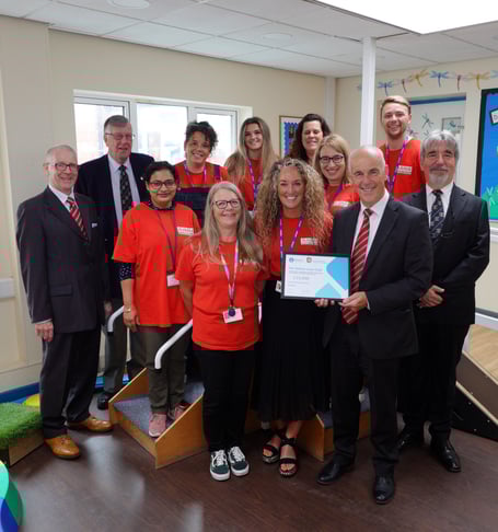 Left to right, front row: At the Hollow Lane Club, Deb Ward (Administrator), Mary Roche (Founder and General Manager), with Nicholas Ball (Provincial Grand Master Devonshire Freemasons), flanked by Asst Provincial Grand Masters Tim Golder on the left and Reuben Ayres on the right.