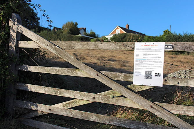 The planning notice on the gate to the field for which planning permission is being sought.  SR 8854