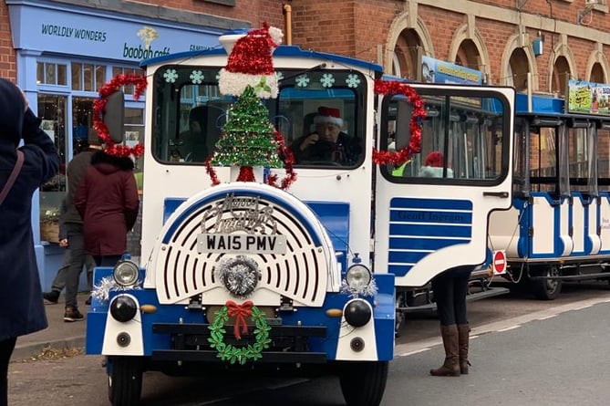 The Land train in Market Street at a previous Christmas in Crediton Lights Switch On.
