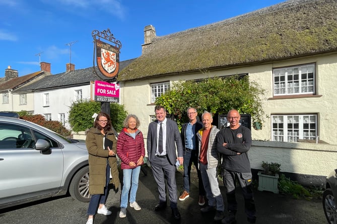 Mel Stride MP, third left, meeting residents in Drewsteignton who are working together to buy The Drewe Arms.