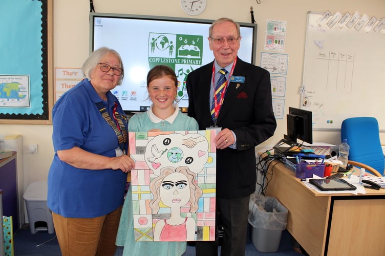 Anna, the Copplestone School winner, with Crediton Lions President Ann Whitehouse and Lion Eric Parkes. SR 8398