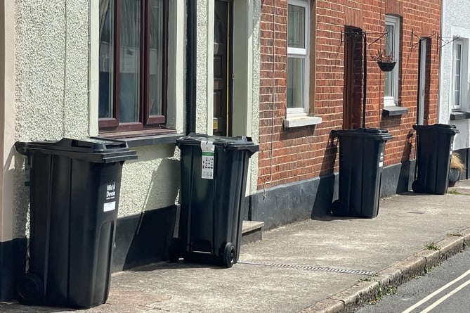 Wheelie bins in a Crediton street.  AQ 2390