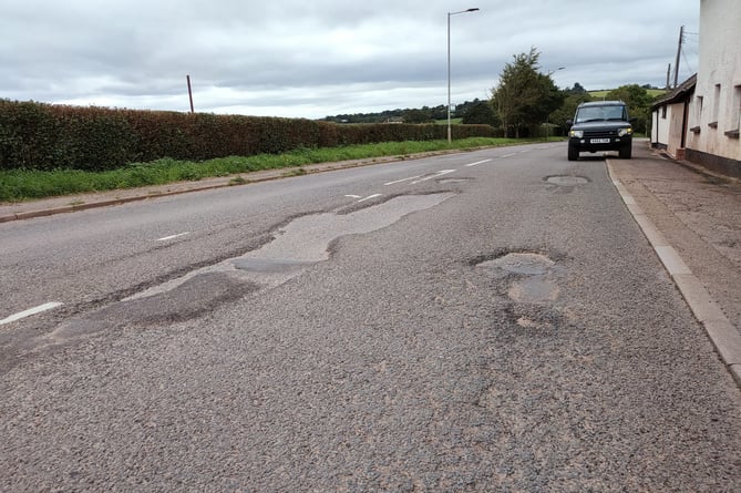 The poor state of the A377 road near Copplestone Farm Shop.